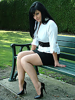 Dark haired office babe goes for a stroll round the park at lunch, to show off her short black shirt and tall stiletto shoes
